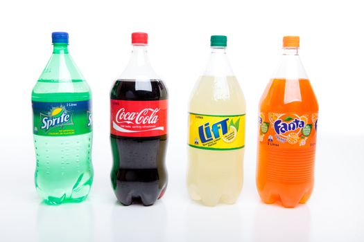 Bottles of carbonated softdrinks.  Varieties are Sprite, Coca Cola, Lift and Fanta.  All drinks made by Coca Cola.