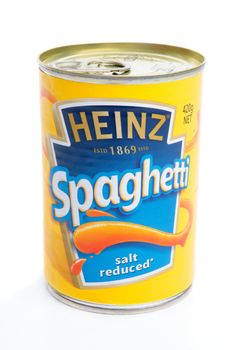 A tin of spaghetti in tomato sauce by Heinz.  White backgrond