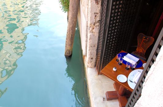 A table set for lunch by the canal