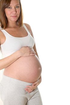 Pregnant woman smiling - in front of white background

