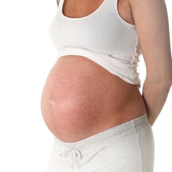 Pregnant woman is only the belly to see the side - in front of white background
