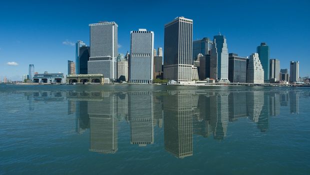 lower manhattan, artificial reflection created in hudson river, photo taken from a boat