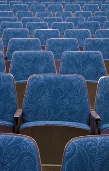 empty blue wooden cinema/theater seats, nice fabric pattern