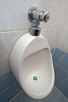 man urinal toilet detail photo, clean wall tiles