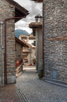 ancient stone homes and street in Verrand, Aosta Valley, Italy. Immagine processed with hdr technique