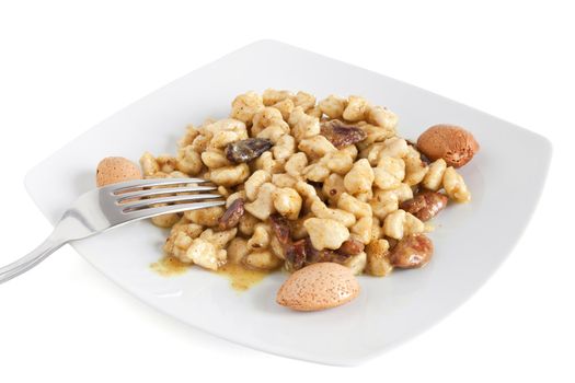 chicken with almonds and curry sauce isolated on white with clipping path