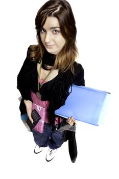 View of a teenager school girl holding books on a white background.