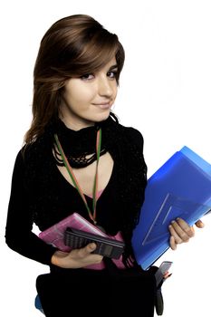 View of a teenager school girl holding books on a white background.