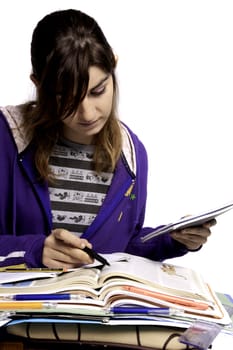 View of a teenager school girl studying on a white background.