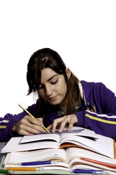 View of a teenager school girl studying on a white background.