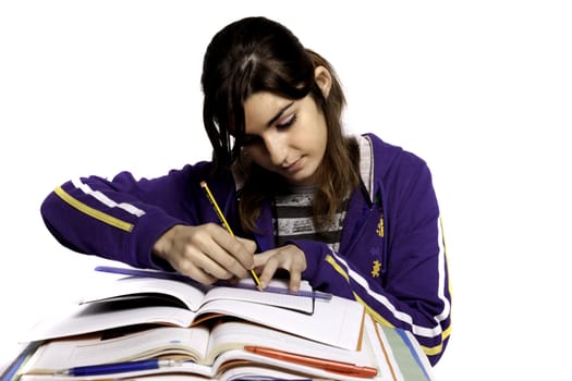 View of a teenager school girl studying on a white background.