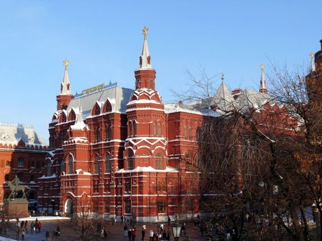 Moscow, Russia - February 23, 2010: Winter day. Peoples walks near national historic musium in Moscow, Russia