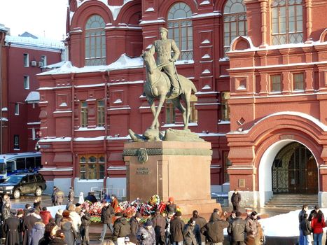 Moscow, Russia - February 23, 2010: Winter day. Peoples walks near monument of Marshal Zhukov in Moscow, Russia