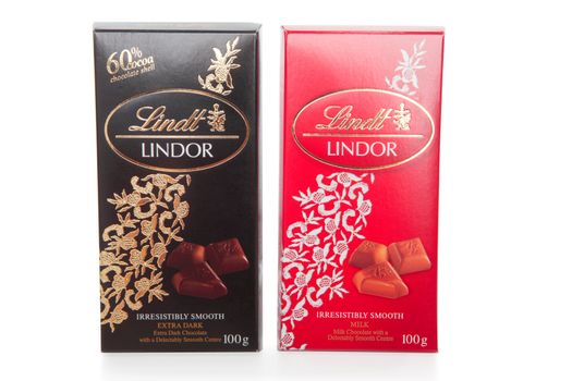 Lindt Lindor premium chocolate bars 100gram.  Milk and Extra Dark with smooth centres.  White background.  EDITORIAL USE ONLY.