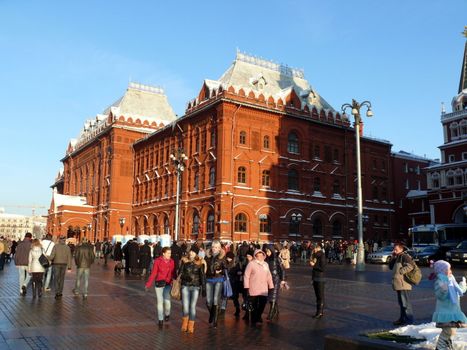 Moscow, Russia - February 23, 2010: Winter day. Peoples walks near national historic musium in Moscow, Russia