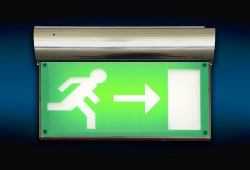Emergency blinking exit sign over blue background
