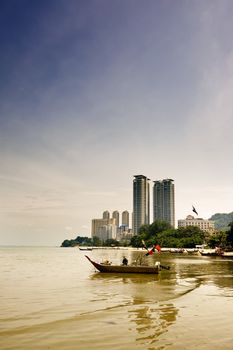 Cityscape of ship on the sea near the port.