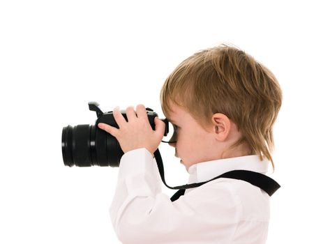 The child in a white shirt with the camera isolated on white background