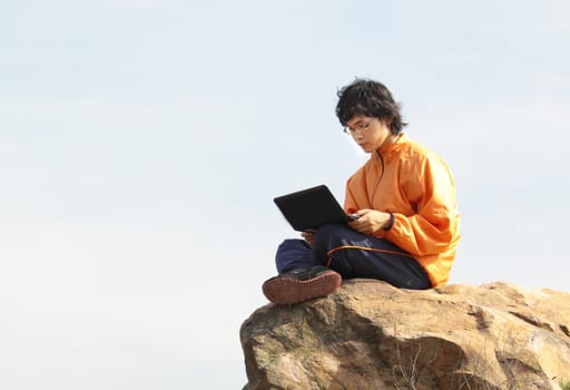 asain Man with notebook at day