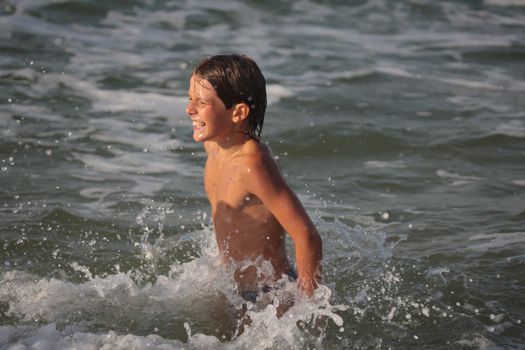people series: swimming boy on sea beach