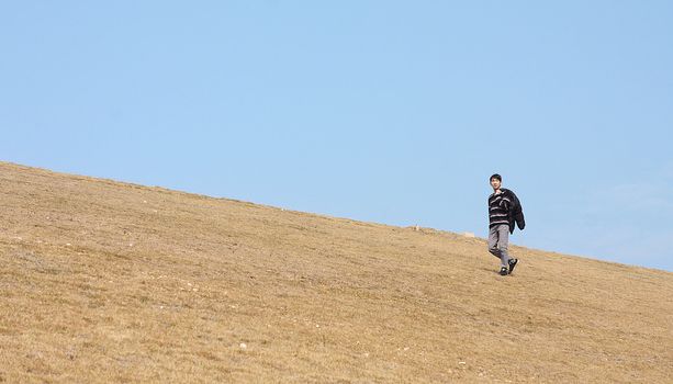man walking on the mountain