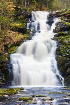 mountain waterfall. fast stream water. autumn landscape