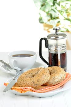 Fresh made bagels served with a cup of coffee.