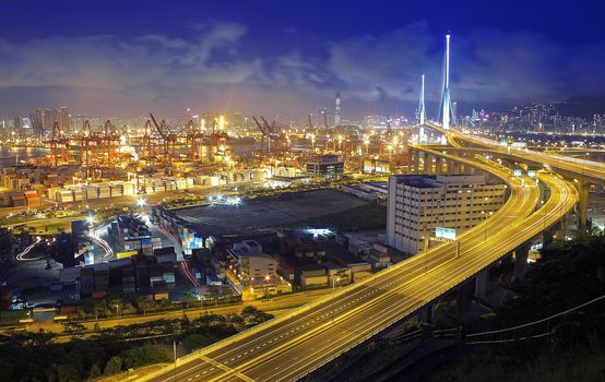 container terminal at night in hong kong
