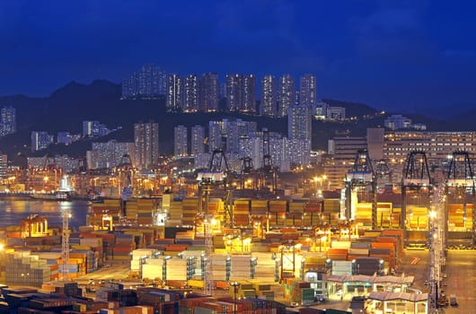 container terminal at night in hong kong