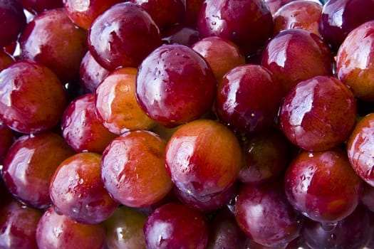 Background of red grapes with water droplets