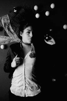 Detail view of a girl next to a snooker table.
