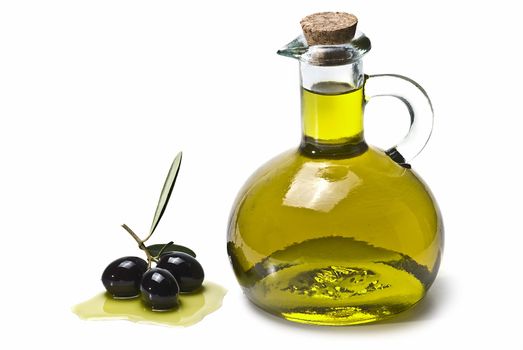 Some olives and olive oil isolated on a white background.