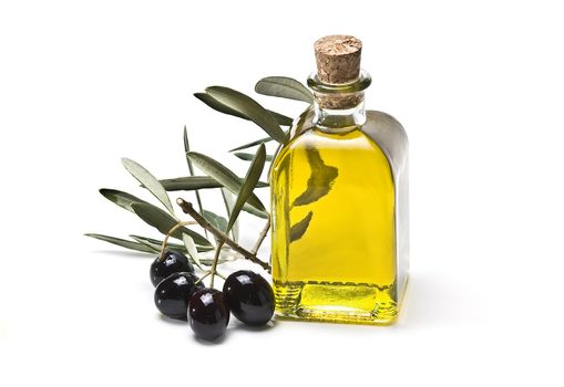 Some olives and olive oil isolated on a white background.