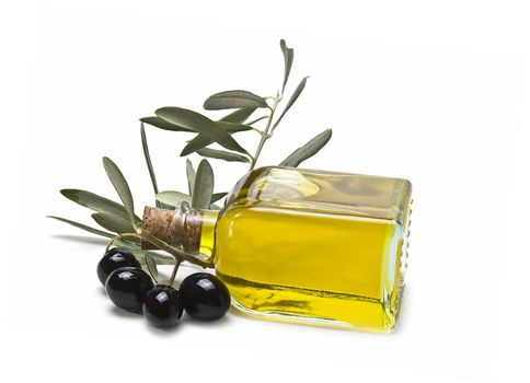 Some olives and olive oil isolated on a white background.