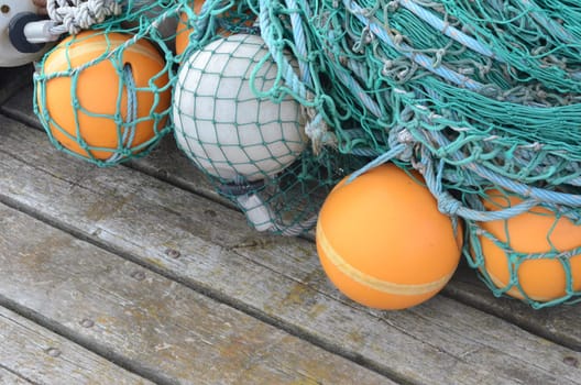 Buoys and fishing nets at a pier.