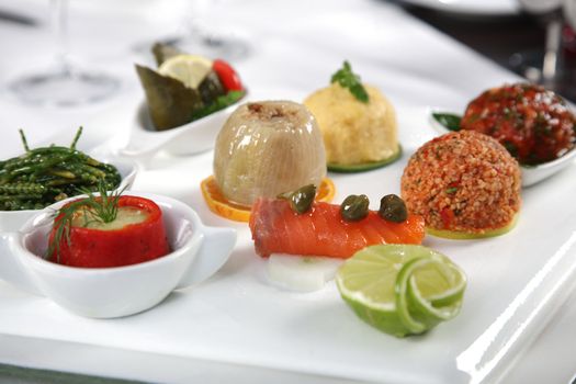 A composition of appetizer with vegetable and fish