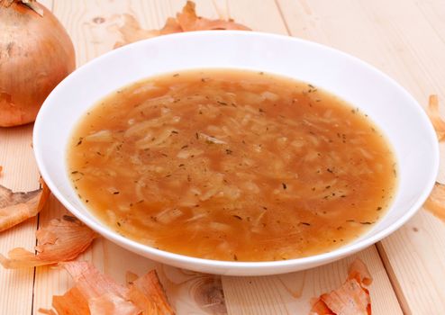Onion Soup in Plate on Wooden Table