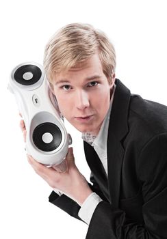 Young blond handsome man holding boombox; isolated on white