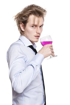 Young man holding a glass of pink wine. Studio photo of blonde man on white background.