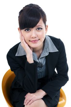 Portrait of a beautiful young businesswoman sitting on chair, isolated over white background