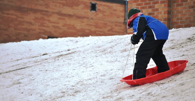 sledding near the sidewalk