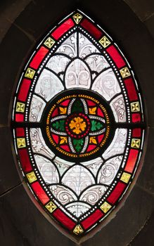 Gothis ornamental stained glass window in a medeval church