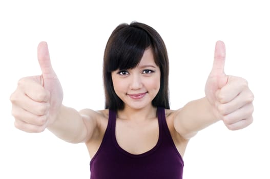 Portrait of an attractive young female giving thumbs up sign over white background.