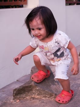 see.. a little girl in action pass the rock.