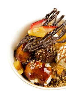 ice cream with chocolate, nuts and caramel close up