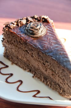 piece of chocolate cake at white plate