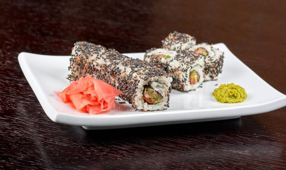 Closeup of Sushi rolls at plate with sesame