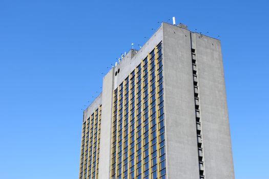 Modern high-rise building on the background of blue sky