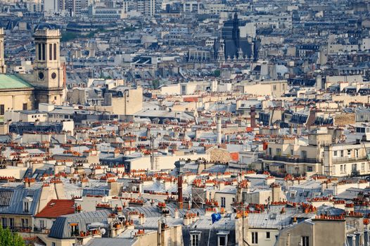 Aerial panorama above houses rooftops in a Paris