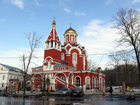 Moscow, Russia - March 27, 2010: Spring day. Peoples walks near church of annunciation of saint godmother in Petrovski park. Moscow, Russia